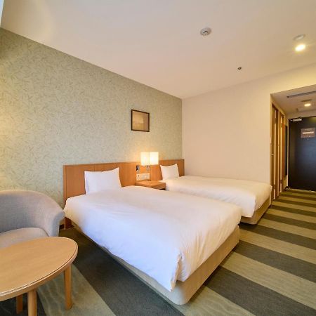 Hotel Granvia Wakayama Buitenkant foto A room at the hotel