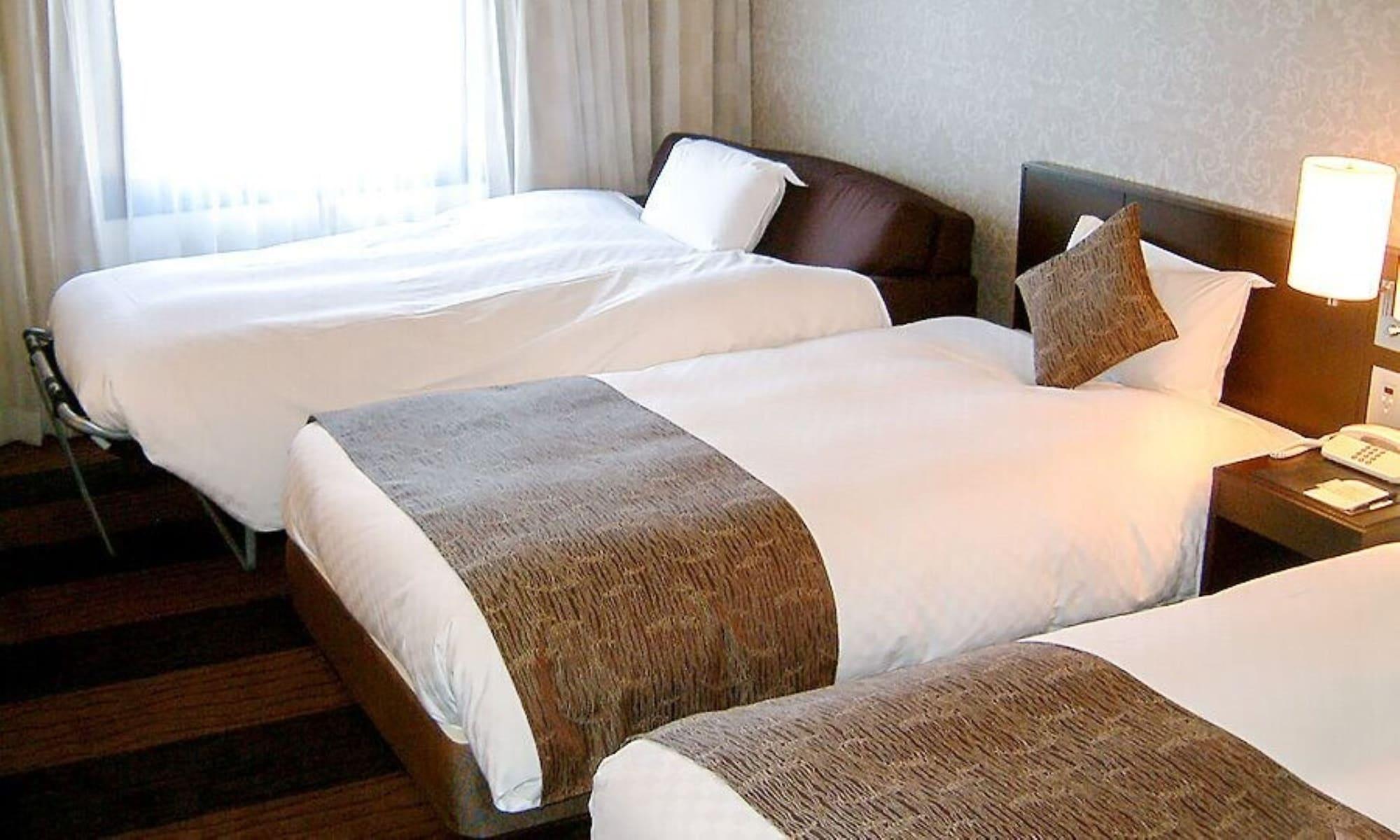 Hotel Granvia Wakayama Buitenkant foto Beds with bed runners
